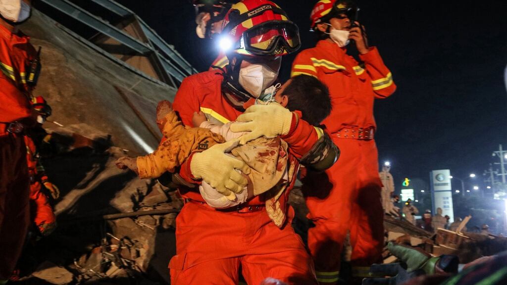 A boy is rescued from the rubble of a collapsed hotel in Quanzhou, in China’s eastern Fujian province early on March 8, 2020. Photograph: STR/AFP/Getty Images