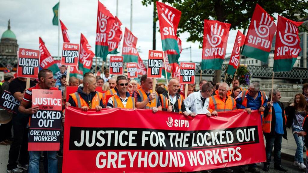 Greyhound workers and others march from Liberty Hall to
Dublin
City Hall in protest at pay cuts yesterday. Photograph: Collins