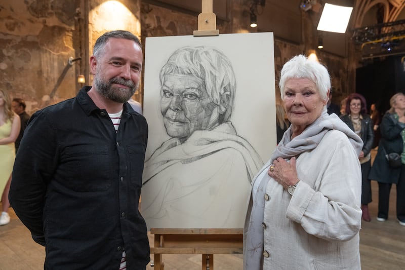 Judi Dench and Gareth Reid with Reid's winning portrait of the actress, 2017