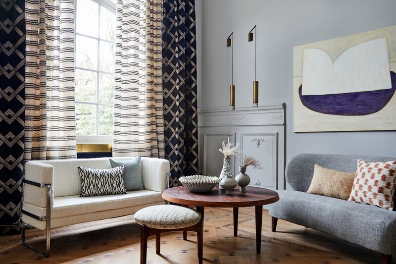 Sofas covered in fabrics by Larsen, with curtains by same