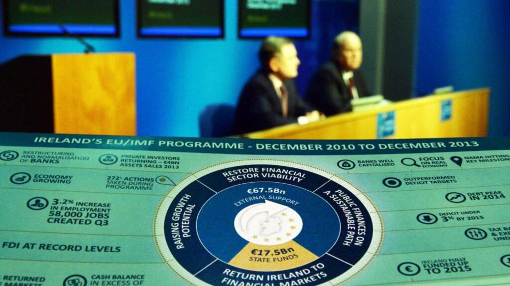 ‘Ireland managed to exit the Troika bailout relatively early because government fiscal policy was operating to a strict four-year economic plan. Now 10 months later the Government is about to launch its first post bailout budget without any detailed overall economic road map.’ Above, Brendan Howlin, Minister for Public Expenditure and Reform with Michael Noonan, Minister for Finance at the announcement of the bailout exit. Photograph: Cyril Byrne / THE IRISH TIMES