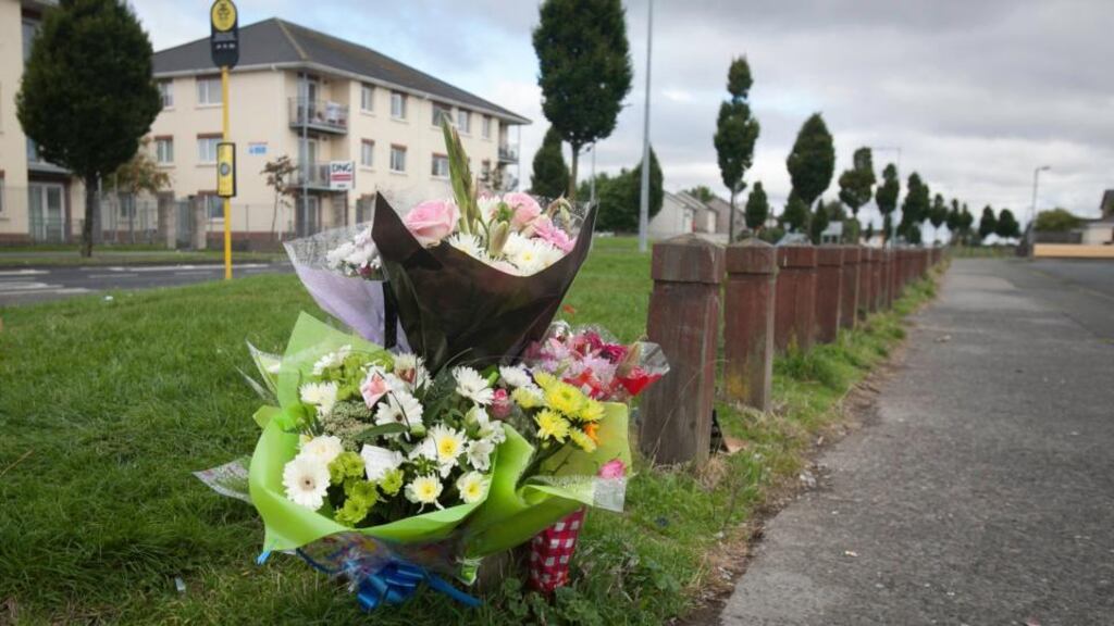A bus stop in the background at the scene of the fatal shooting at the weekend of Dean Johnston at Ronanstown, Dublin. Gardaí have renewed an appeal for information on his murder. Photograph: Gareth Chaney/Collins