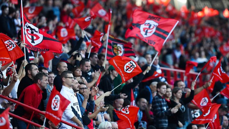 Toulouse fans wave flags during the European Champions Cup match against Leinster at Stade Ernest Wallon. The club have always been one of the best suported in France. Photograph: Manuel Blondeau/Icon Sport via Getty Images)