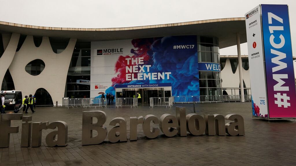 Workers put the finishing touches on the Fira Gran Via exhibition centre before the Mobile World Congress opens on Monday in Barcelona. Photograph: Reuters/Albert Gea