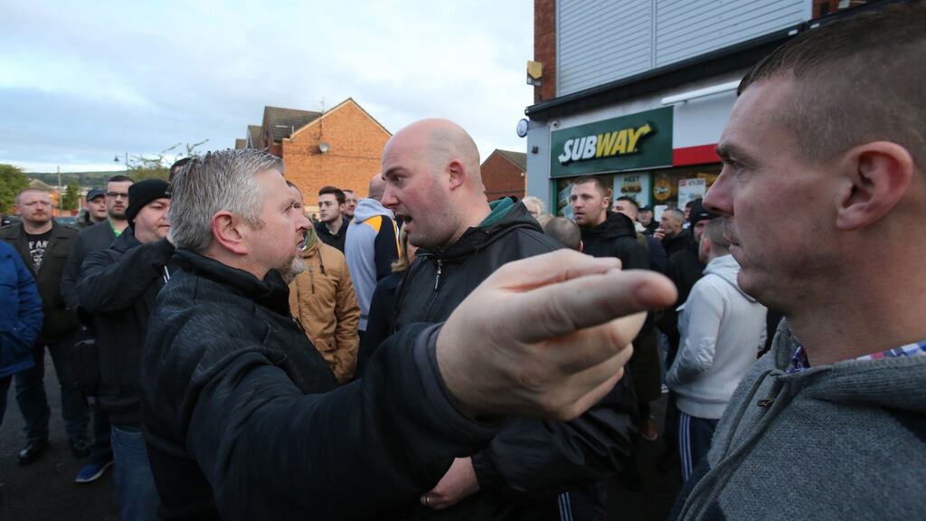 Dee Fennell (centre), a spokesman for the Greater Ardoyne Residents’ Collective (Garc), argues with local priest Father Gary Donegan (left) after an Orange Order parade passed along the Crumlin Road adjacent to the nationalist Ardoyne district in north Belfast. Photograph: Niall Carson/PA Wire