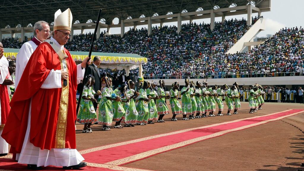 Pope Francis walks with the pastoral staff as he arrives to celebrate a mass in the Barthelemy Boganda Stadium, in Bangui, Central African Republic, on Monday. Photograph: Andrew Medichini/AP