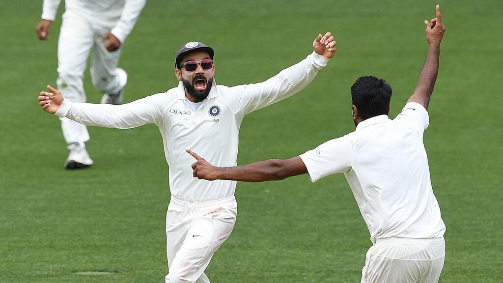 Captain Virat Kohli and Ravi Ashwin celebrate India’s first Test win over Australia in Adelaide. Photograph: Dave Hunt/EPA