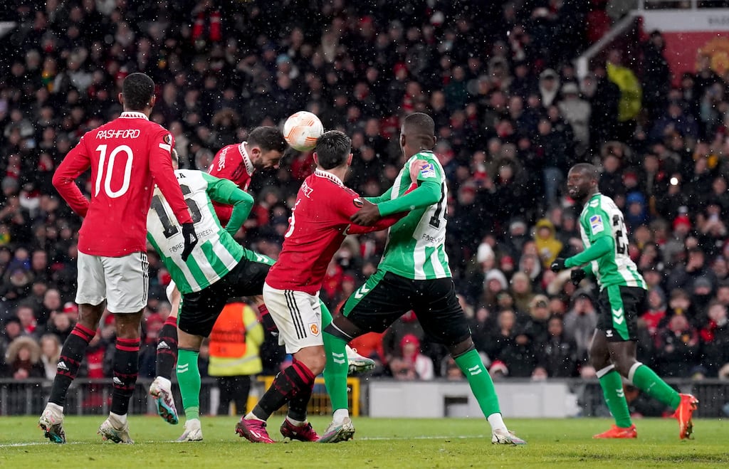 Manchester United's Bruno Fernandes heads home his side's third goal during the Europa League round of 16, first-leg match against Real Betis at Old Trafford. Photograph: Tim Goode/PA Wire