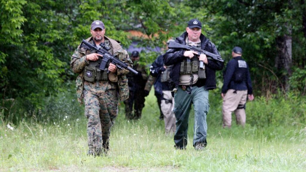 Law enforcement officers search a residential area for prison escapees David Sweat and Richard Matt, Monday, June 15th, 2015, in Saranac, New York.  Photograph: Mike Groll/AP Photo