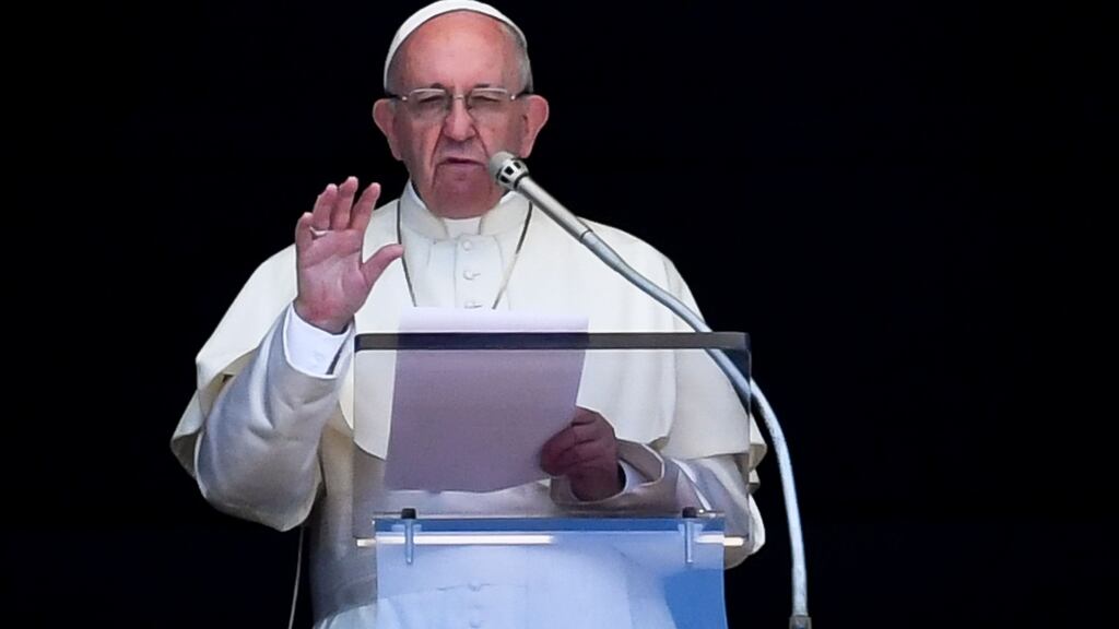 Pope Francis delivers his speech to the crowd from the window of the apostolic palace overlooking St Peter’s Square on Sunday. Photograph: Andreas Solaro/AFP/Getty Images
