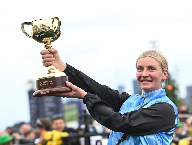 Jamie Melham poses with the trophy after riding Half Yours. Photograph: Vince Caligiuri/Getty Images
