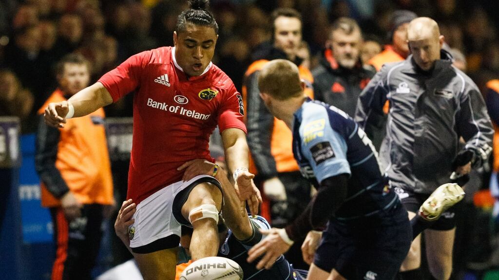 Munster’s Francis Saili kicks through during the Guinness Pro 12 game against Cardiff Blues at Cardiff Arms Park. Photograph: Simon King/Inpho