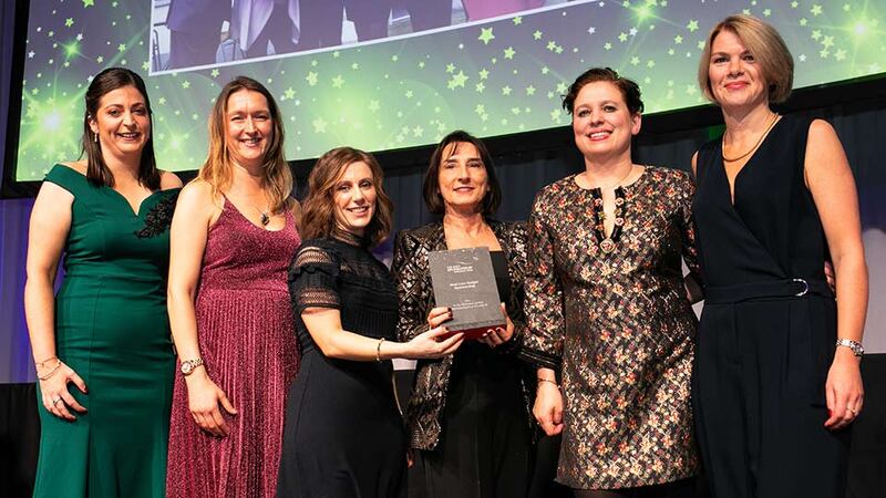 Margaret Colton, Head of Marketing, Dunnes Stores, presents the Best Low Budget Sponsorship award to the BWG Foods & Post TV Team.