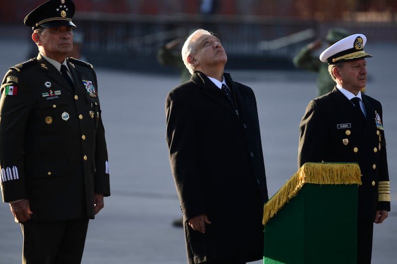 Andrés Manuel López Obrador (centre), Claudia Sheinbaum's predecessor as Mexican president, with then defence secretary Luis Sandoval and navy secretary José Rafael Ojeda in 2023. Photograph: Claudio Cruz/AFP/Getty