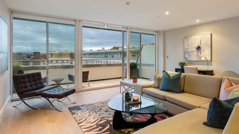 Top-floor living room opening to balcony