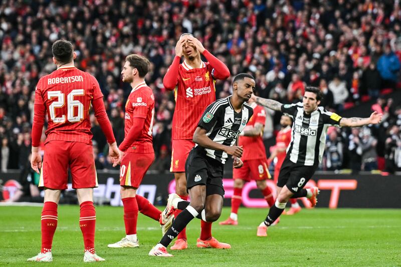 Newcastle United striker Alexander Isak (centre) reacts next to Liverpool defender Virgil van Dijk after scoring his team second goal during the English League Cup final at Wembley Stadium in March. Photograph: Glyn Kirk/AFP via Getty Images