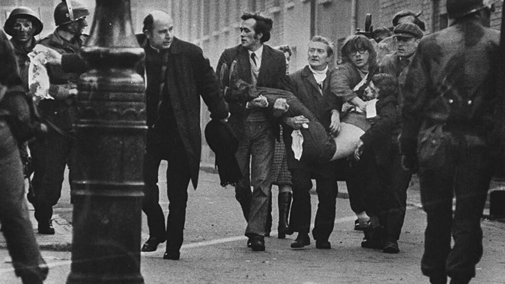 History being rewritten ? .... Father Edward Daly runs down the street with an injured man on “Bloody Sunday’ January 30th, 1972. “The young people who swarmed into the IRA in the aftermath of Bloody Sunday ... were behaving in a rational way and at considerable risk to themselves...”