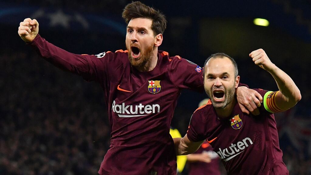 Lionel Messi celebrates scoring Barcelona’s equaliser with team-mate Andres Iniesta in the Champions League round of 16 first leg against Chelsea at Stamford Bridge. Photograph: Ben Stansall/AFP/Getty Images