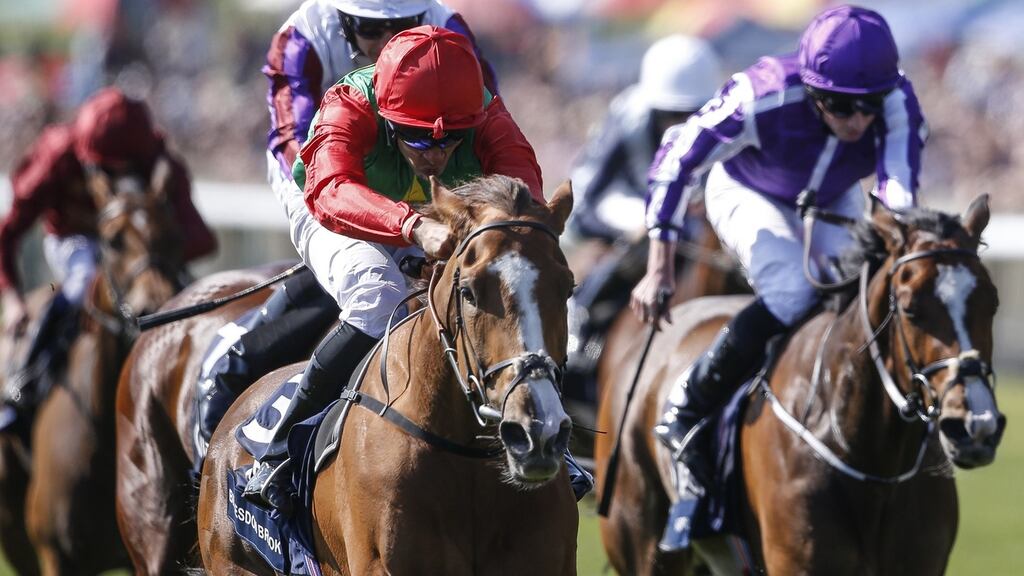 Sean Levey and Billesdon Brook (L) takes the 1000 Guineas ahead of Happily (R). Photograph: Alan Crowhurst/Getty