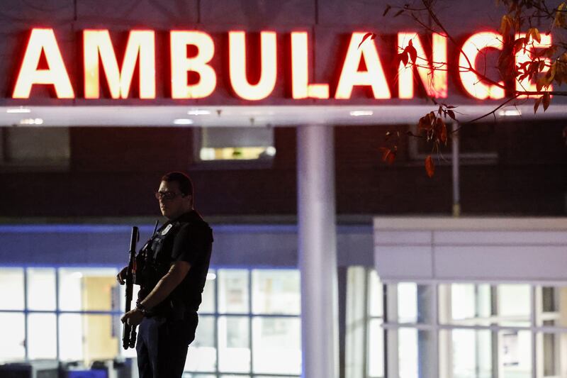A police officer standing guard in front of the Central Maine Medical Centre. Photograph: CJ Gunther/EPA