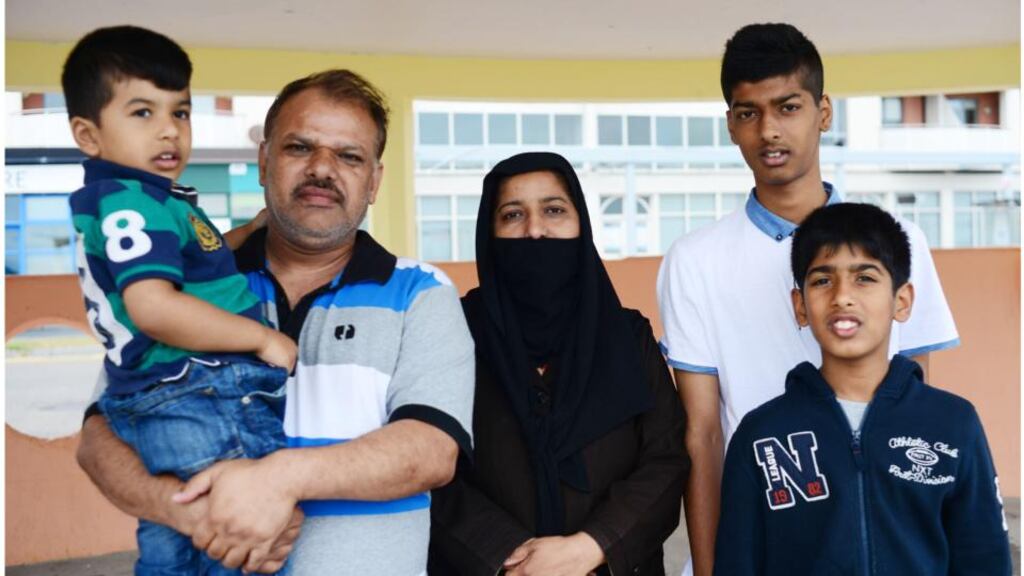 Laiq and his wife Amtul with their sons Waleed (15) Nabeed (11) and Sarmad (4). The family lives and sleeps in one room in the Eglinton direct provision centre in Salthill. Photograph: Bryan O’Brien