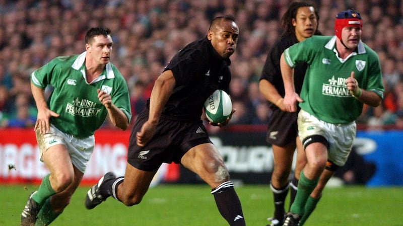 Jonah Lomu splits the Ireland defence of David Wallace and Anthony Foley during the 2001 November international at Lansdowne Road. Photograph: Ross Land/Getty Images