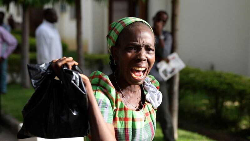 A woman  reacts as she sees victims of a bomb blast arriving at the Asokoro General Hospital in Abuja. Photograph: Afolabi Sotunde/Reuters