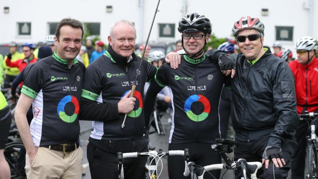 Shane Finnegan, deputy First Minister Martin McGuinness, Joe Brolly and First Minister Peter Robinson at the start of the Life Cycle Challenge in Belfast today. Photograph: PA Wire