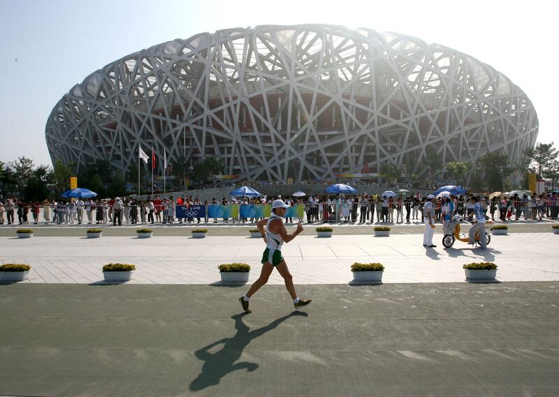Jamie Costin passes the Birds Nest during the men's 50k walk in Beijing in 2008. Photograph: Lorraine O'Sullivan/Inpho
