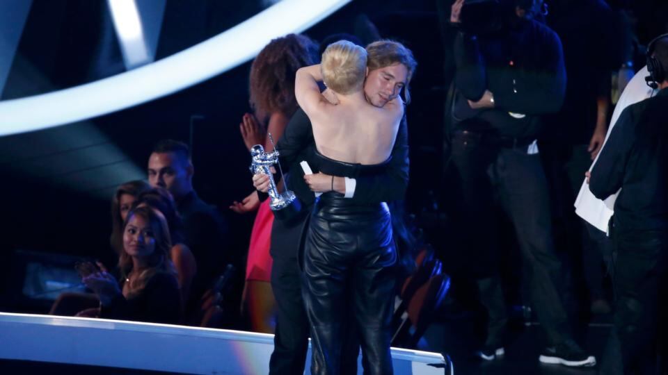 Miley Cyrus hugs her spokesperson Jesse after he accepted the award for video of the year on her behalf. Photograph: Lucy Nicholson/Reuters