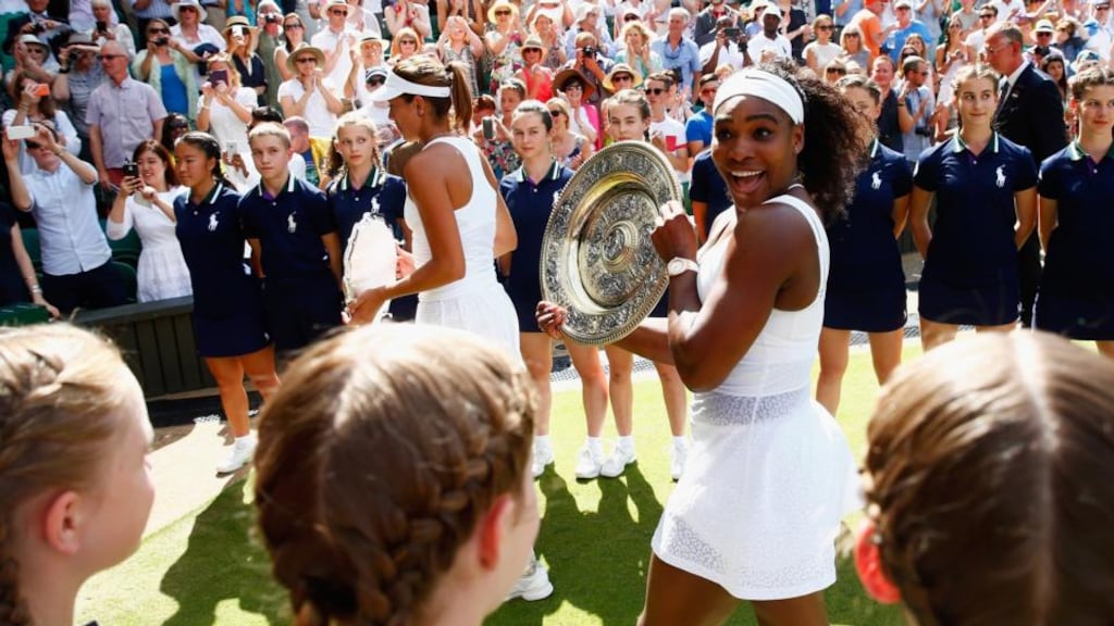 Serena Williams leaves court with the Venus Rosewater Dish after her victory in the women’s singles against Garbine Muguruza. Photograph: Julian Finney/Getty Images.
