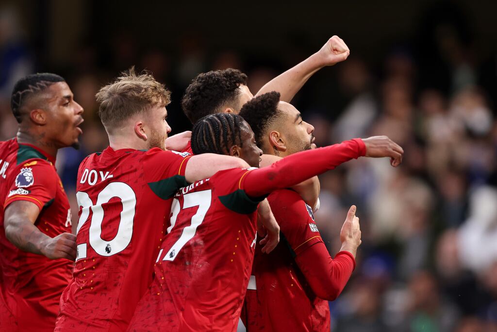 Matheus Cunha celebrates with team-mates after scoring Wolves' fourth goal and completing his hat-trick from the penalty spot in the Premier League game against Chelsea at Stamford Bridge. Photograph: Alex Pantling/Getty Images