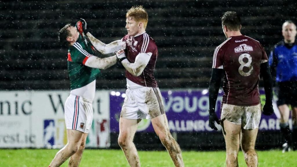Mayo’s Michael Plunkett and Peter Cooke of Galway get acquainted during the FBD Connacht Football League match at MacHale Park in Castlebar. Photograph: Tommy Dickson/Inpho