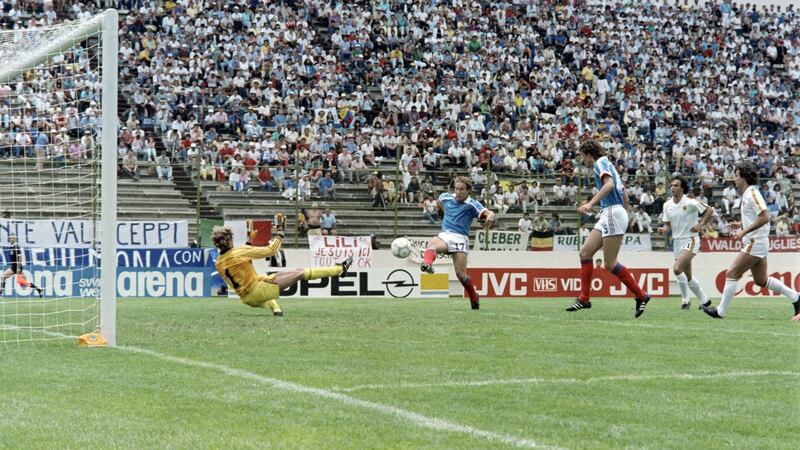 French football player Jean-Pierre Papin scores a goal against Belgian goalkeeper Jean-Marie Pfaff during the third-place playoff at the 1986 World Cup in Puebla. Mexico. Photograph: AFP via Getty Images
