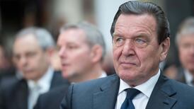Former German chancellor Schröder defends Merkel on euro crisis
