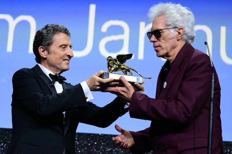 Jim Jarmusch receives the Golden Lion for Best Film for Father Mother Sister Brother from Venice Film Festival president Pietrangelo Buttafuocco on Saturday. Photograph: Tiziana Fabi/AFP via Getty Images