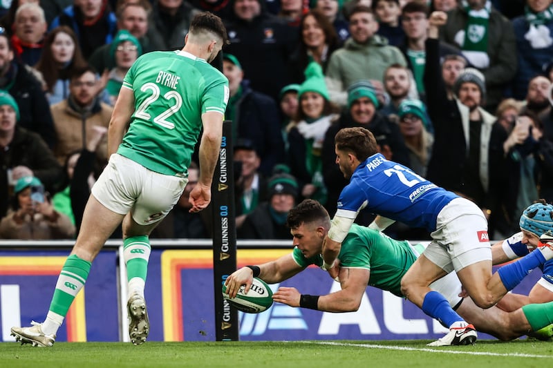 Ireland's Calvin Nash scores a try despite efforts from Martin Page-Relo of Italy. Photograph: Ben Brady/Inpho