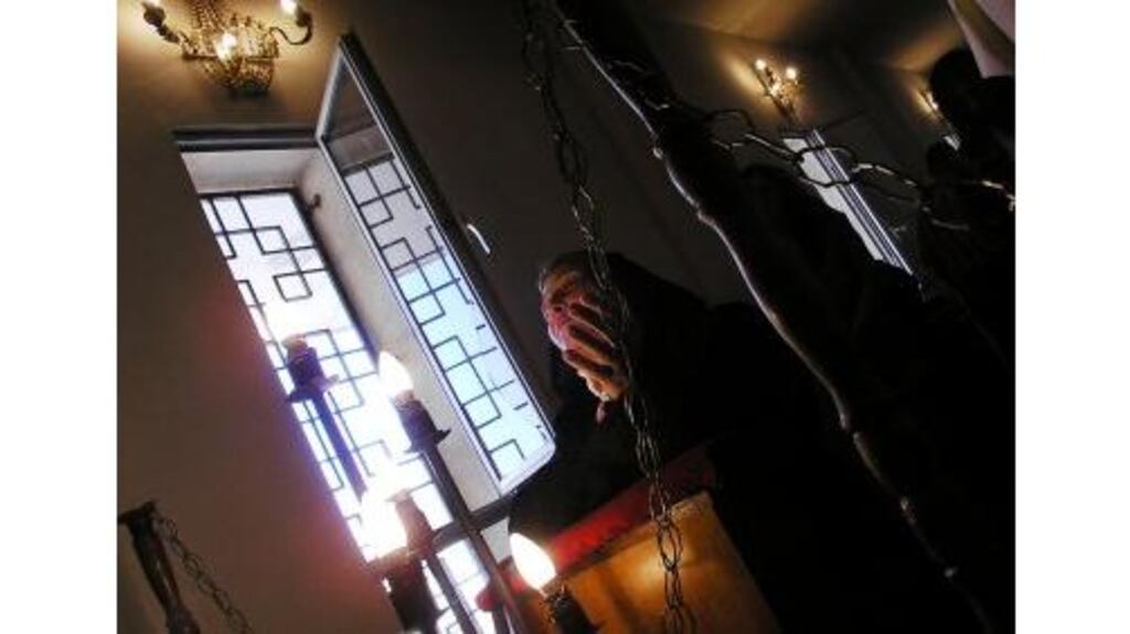 An Iraqi Christian prays during the Easter Mass in Baghdad yesterday. Iraq's Chaldean and Assyrian Catholics trace their origins to Addai and Mari, followers of St Thomas who walked from Palestine to Turkey and Mesopotamia in the first century AD. There are approximately a million Christians in Iraq.