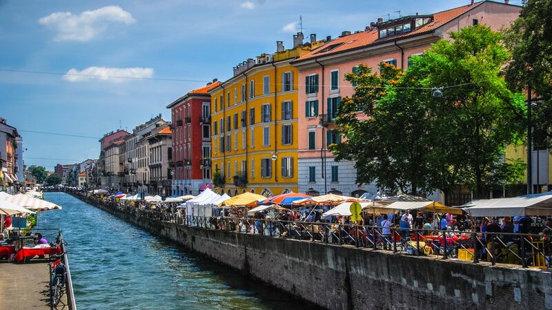 Milan’s Naviglio Grande has bars, cafes, and a busy street market. Photograph: Getty Images