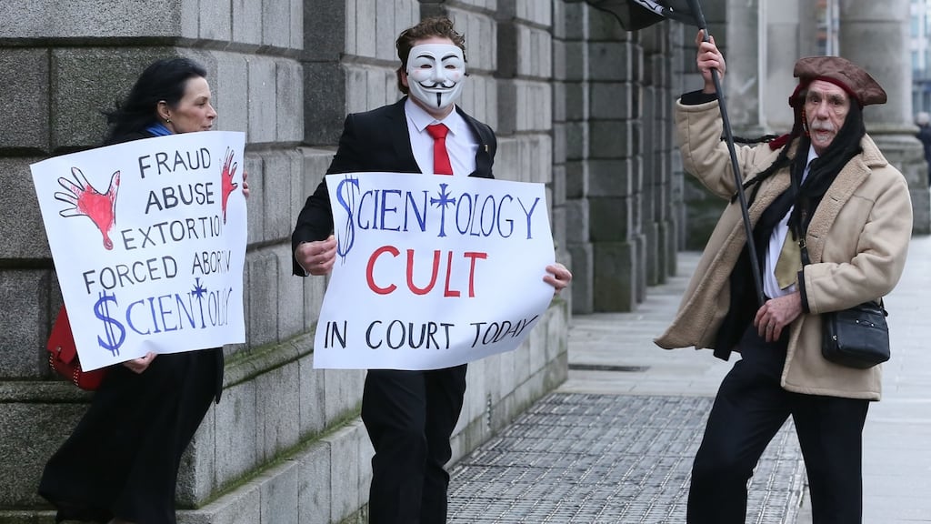 Anti-Church of Scientology protesters stage a demonstration outside the Four Courts in Dublin before an action involving a member of the church, Zabrina Collins. Photograph: Courts Collins