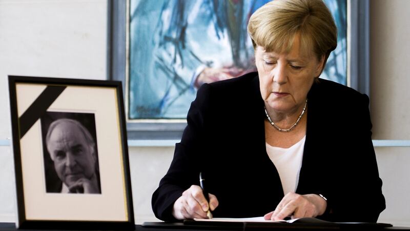 German chancellor Angela Merkel: She and thousands of ordinary Germans expressed their condolences to the Kohl family, and respect for the man whose political decisions changed their lives forever. Photograph: Carsten Koall/EPA