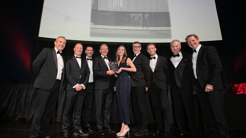 Niall Feely, Strategy and Growth Director, Ethos Engineering, presents the Building of the Year – Small Office award to the Henry J Lyons team.