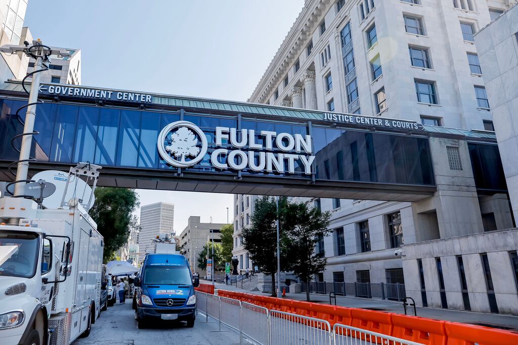 News media gather as enhanced security measures are implemented outside the Fulton County Courthouse in Atlanta, Georgia ahead of a possible grand jury indictment against former US President Donald Trump for 2020 election interference. Photograph: Erik S Lesser/EPA