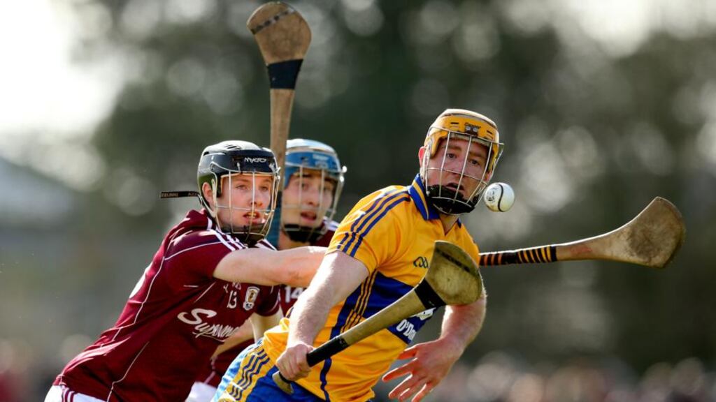 The Galway duo of Cathal Mannion and Conor Cooney close down Clare’s Cian Dillon during the Allianz Hurling League Division 1A clash Cusack Park in Ennis. Photograph: James Crombie/Inpho
