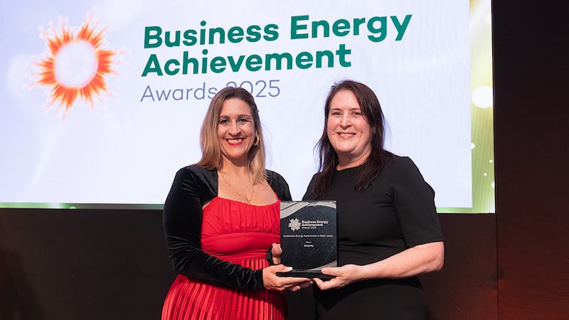 Katherine Valery, awards judge, presents the sustainable energy achievement in water usage to Anne Butterly, Easydry
