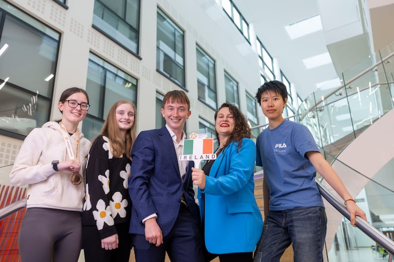 Siobhan McGale (18), Charlotte Walmsley (16) and Siqin You (18 - right) with Irish Maths Olympiad winner Fionn Kimber O'Shea (centre) and maths lecturer Dr Myrto Manolaki at UCD. Photograph: Tom Honan
