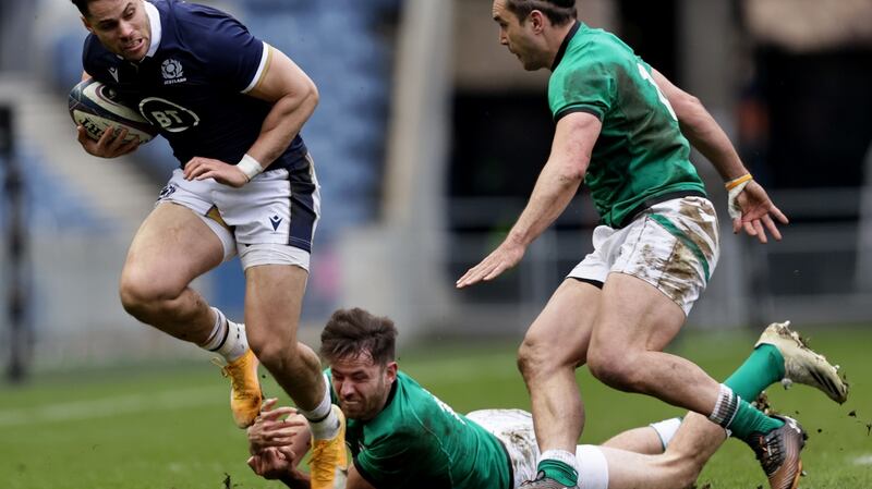 Hugo Keenan and James Lowe try to tackle Sean Maitland. Photograph: Laszlo Geczo/Inpho