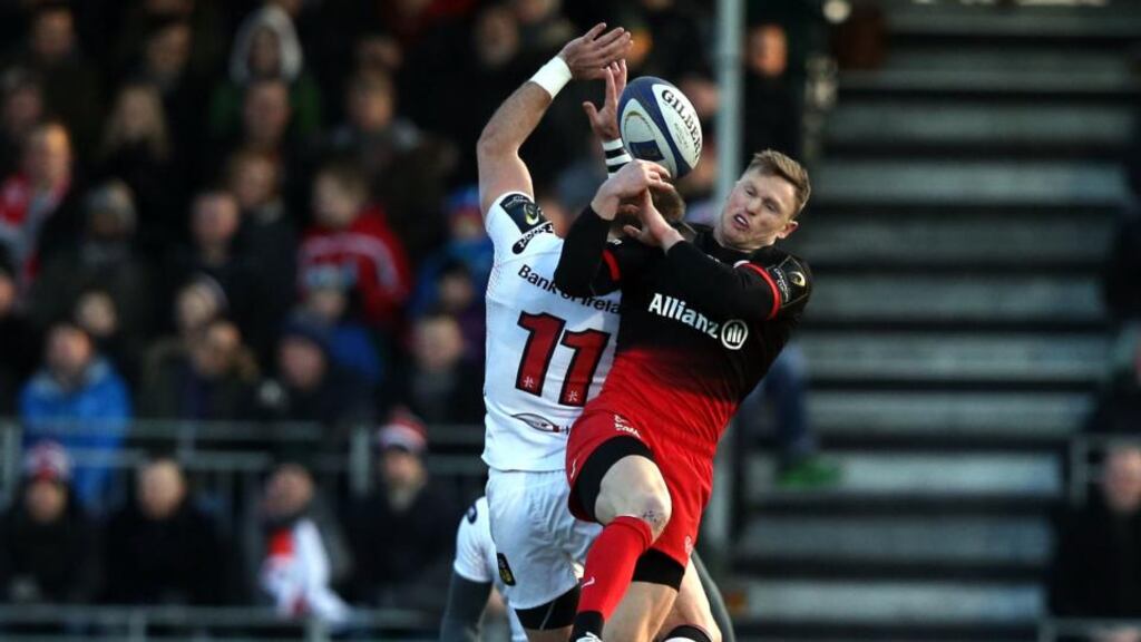 Saracens winger Chris Ashton goes for a high ball with Ulster’s Craig Gilroy during the Champions Cup game at Allianz Park. Photograph: Andrew Fosker/Inpho/Presseye