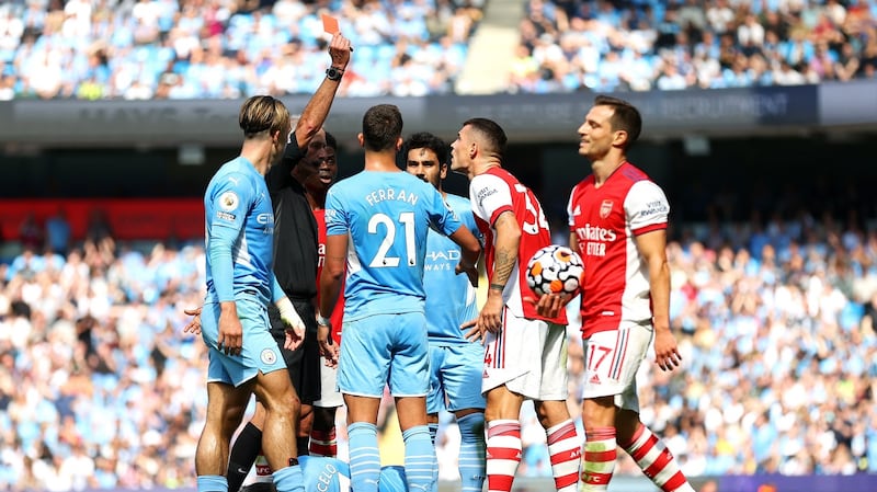 Referee Martin Atkinson sends off Granit Xhaka at the Etihad Stadium. Photograph: Catherine Ivill/Getty Images
