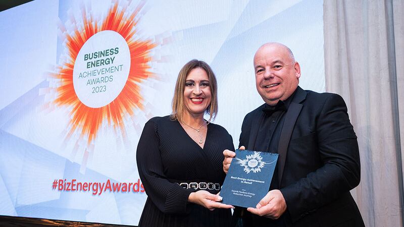 Katherine Valery, awards judge, presents best energy achievement in retail award to Ian Hunter, Swords Pavilions